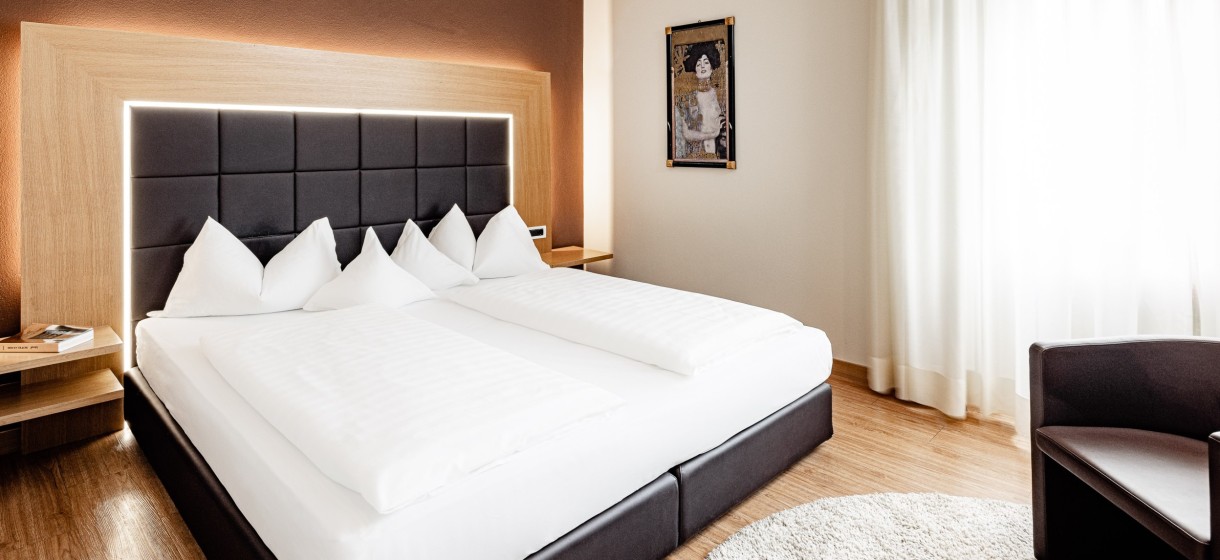 Bild einer Suite im Meranerhof Wunderschönes Schlafzimmer einer Suite im Meranerhof